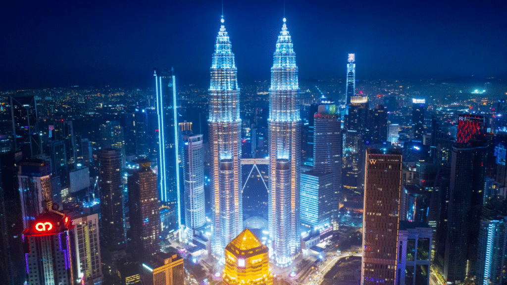 Petronas Twin Towers and Kuala Lumpur skyline illuminated at night